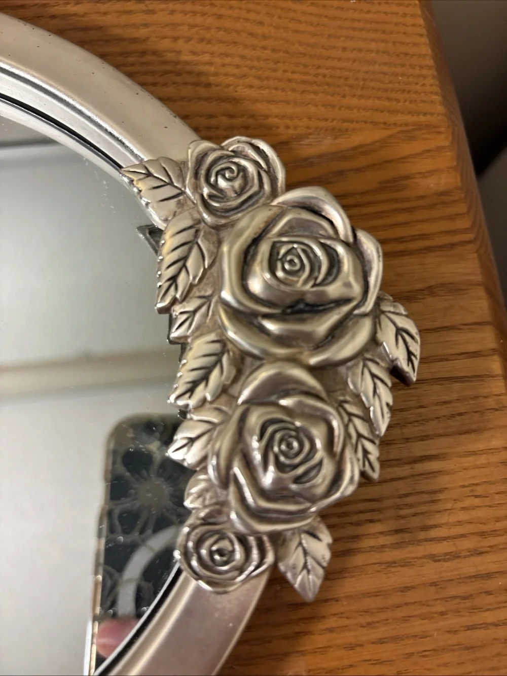 Elegant Silver Oval Wall Mirror with Rose Accents